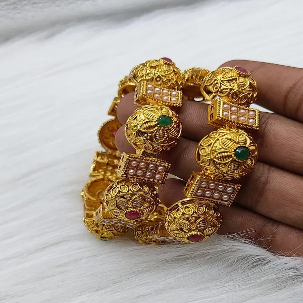 https://d1311wbk6unapo.cloudfront.net/NushopCatalogue/tr:f-webp,w-600,fo-auto/RAJASTHANI BANGLES SET_1674124661889_fsebdhnxdplupud.jpg__Padmawati Bangles   Private Limited